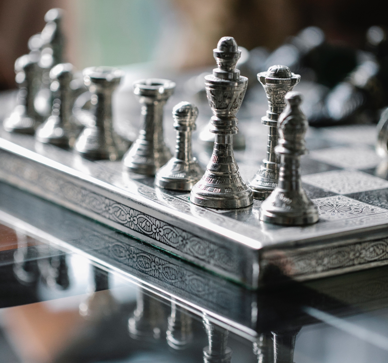 
	An elegant and old chess game on going with all the pieces in place
