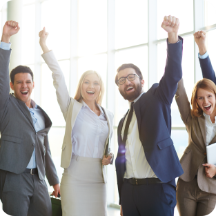 
	A group of business people cherring at the same time with their hands up in the air
