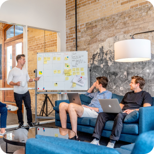 
	Group of men planing the next job opportunity at their meeting room while they discuss 
